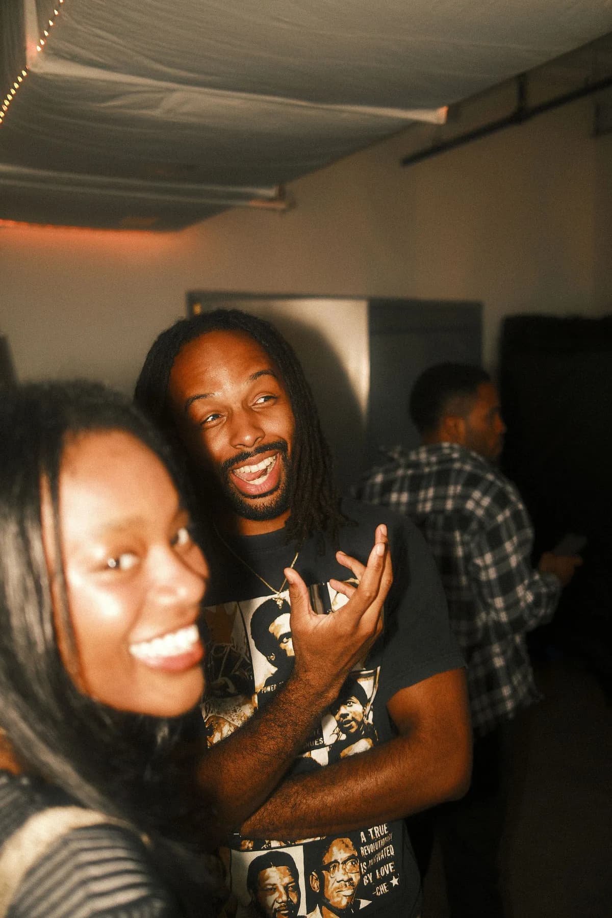 Two friends laughing at OTL Sessions vol. 1.